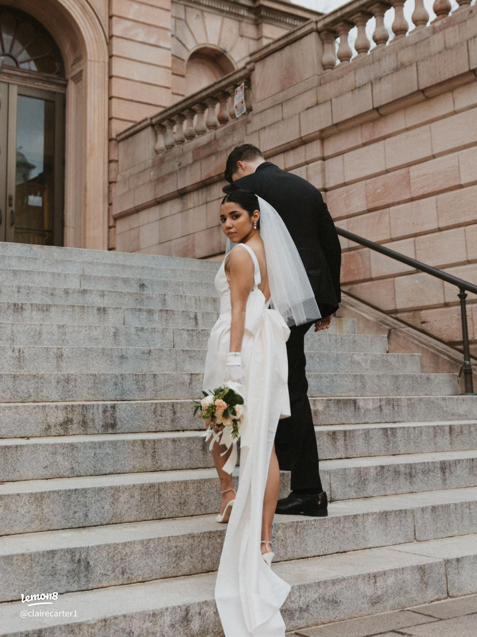 Bride and groom on courthouse steps